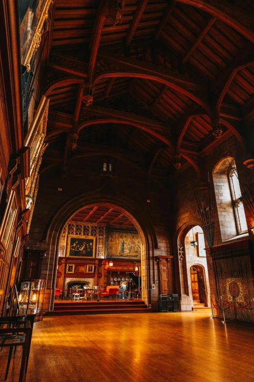 an empty room with stone fireplaces and ceiling with lights