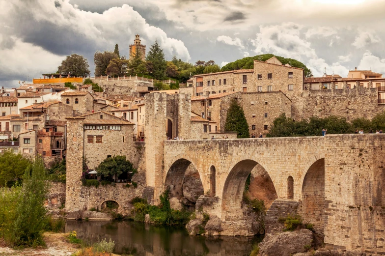 an old city is built on top of a hill