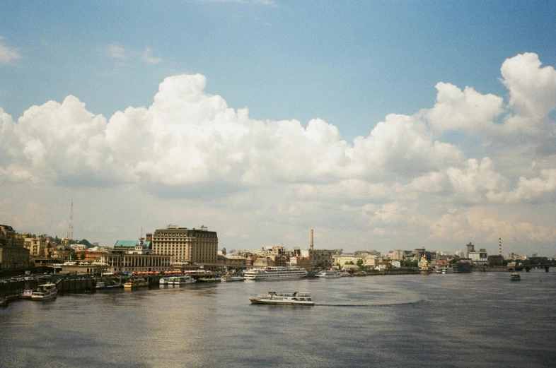 there is a boat in the water near a city