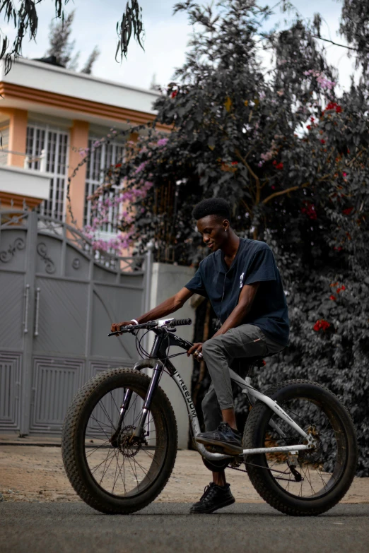 a man riding his bike with his hands on the tire