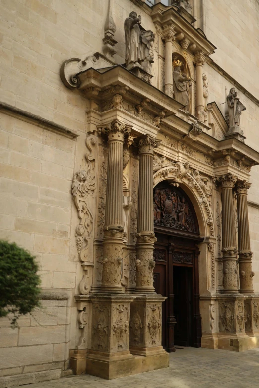 a building with stone work and a wooden door