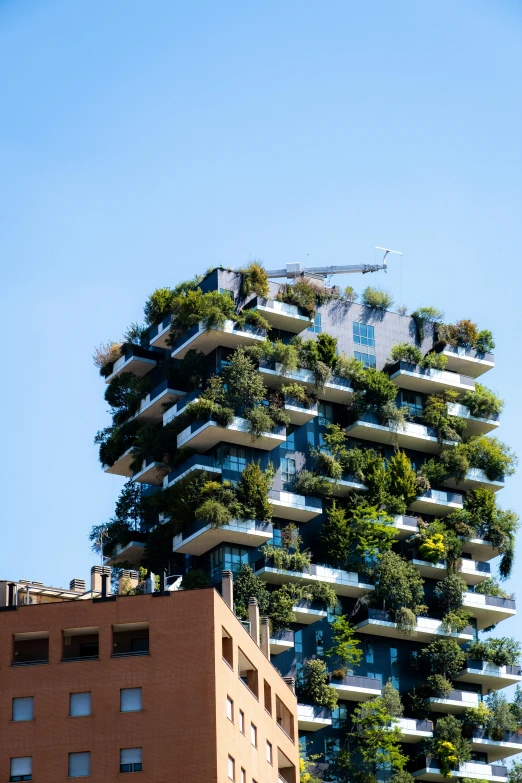 a large tree filled building towering over a city