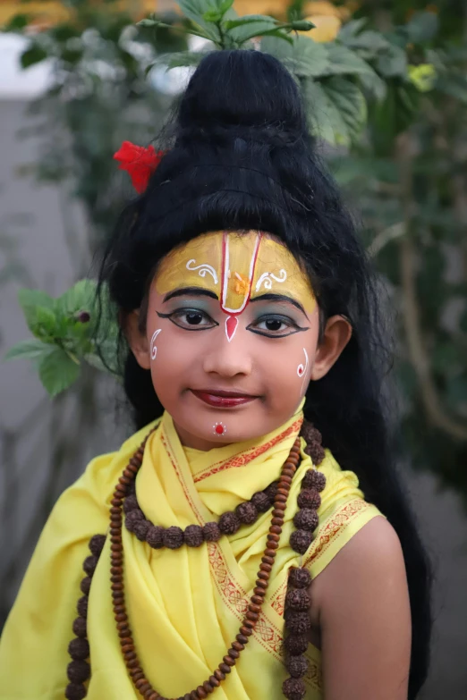 a young indian girl dressed up and smiling