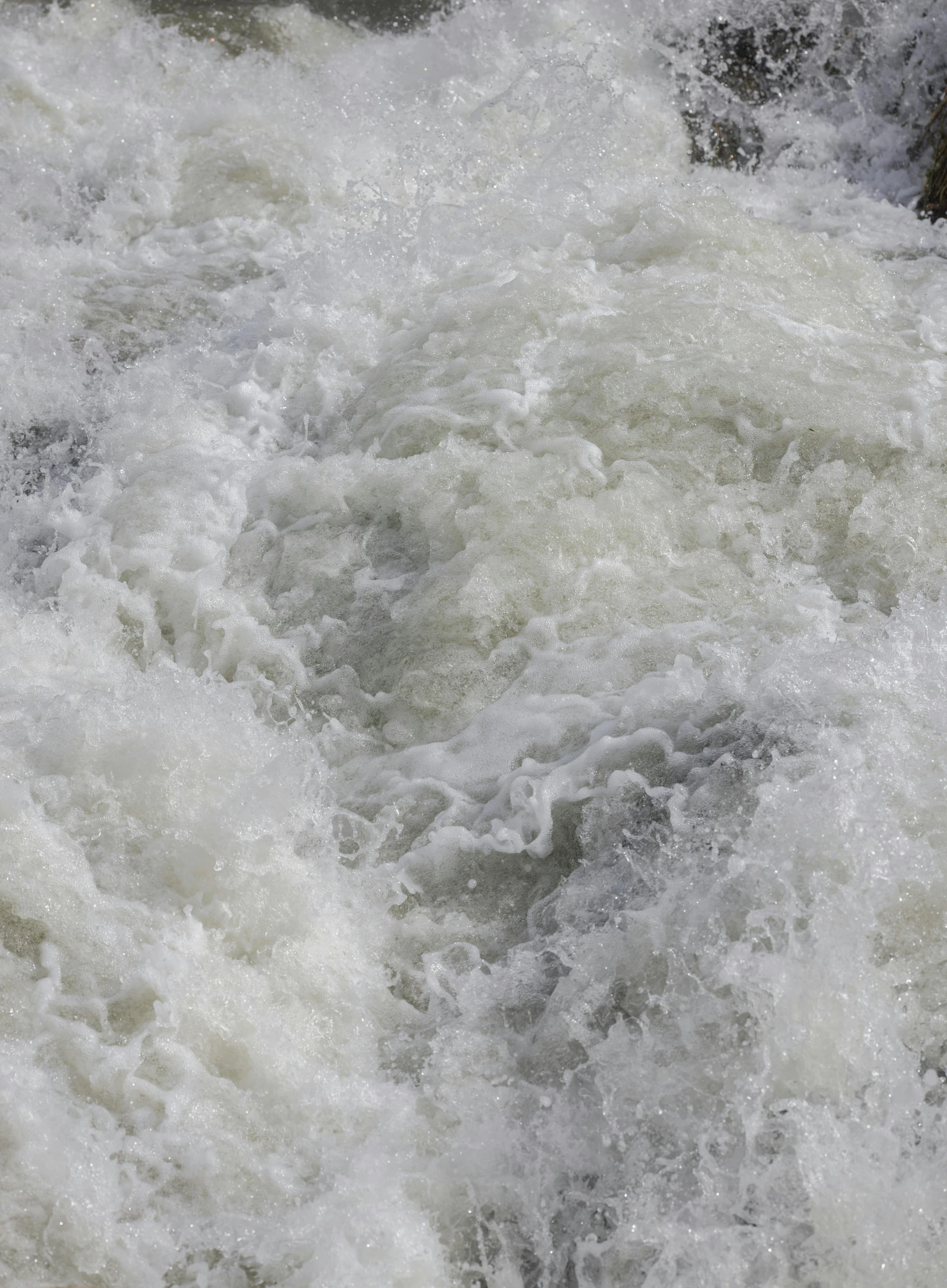 some white water and rocks in some water