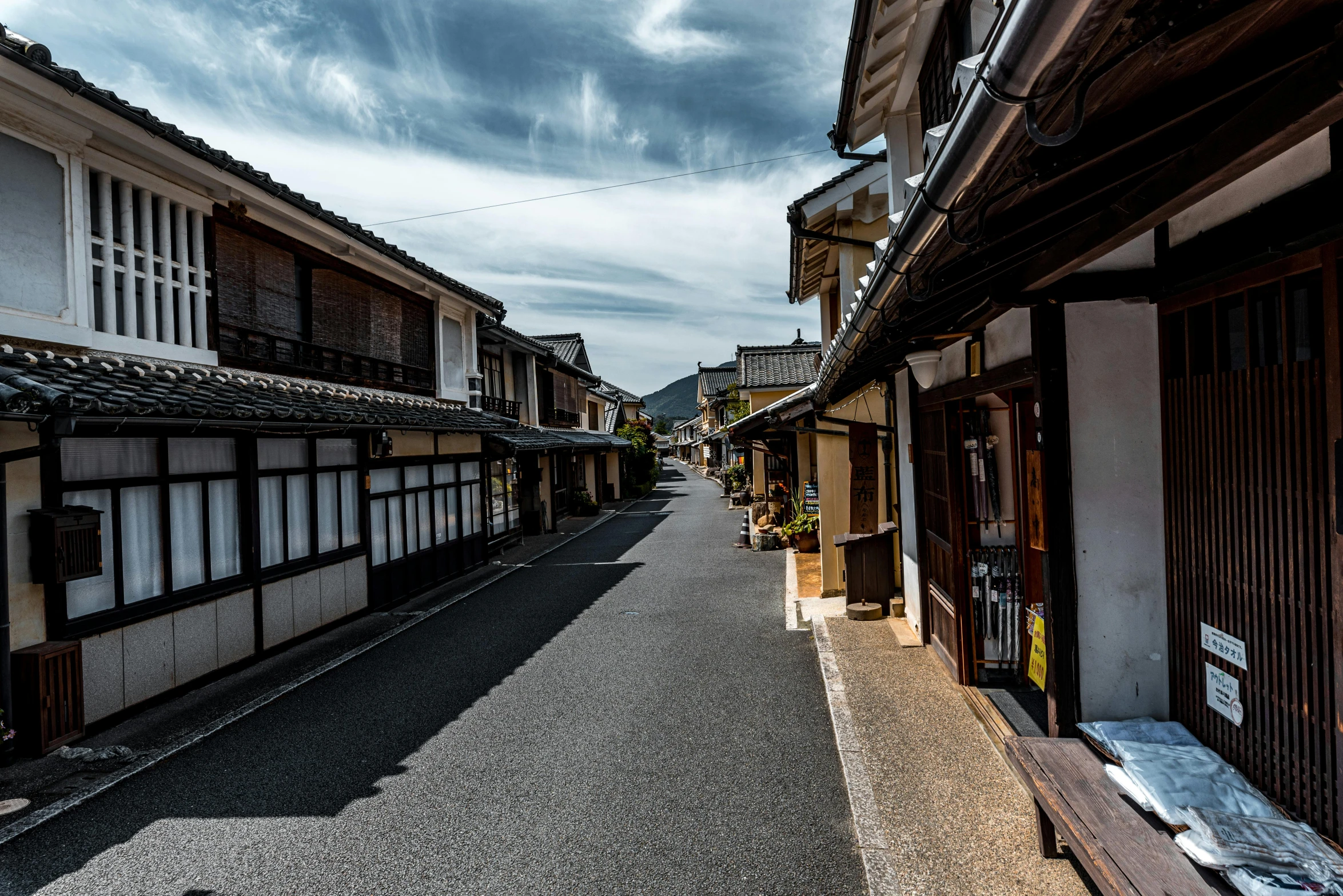 a black and white po of a street with houses on the side