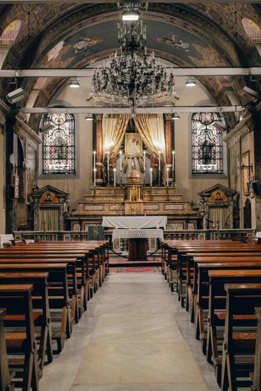 the inside of an old church with stained glass windows