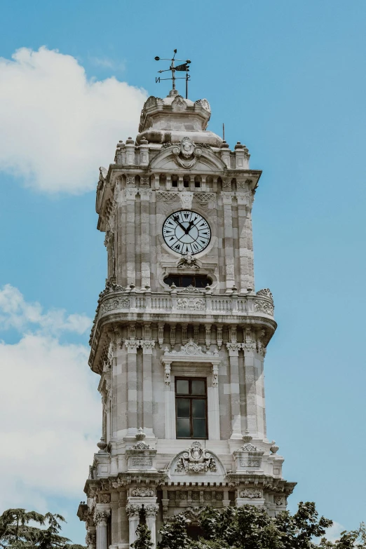 the large tower has a clock on the top of it
