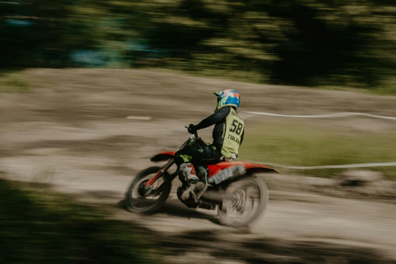 a person riding a dirt bike on a hill