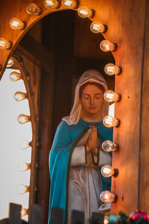 the statue is inside of a wooden church