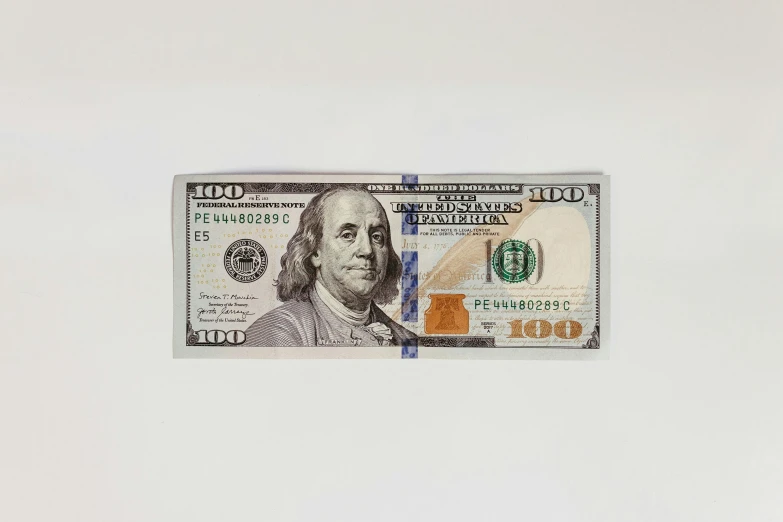 a $ 5 bill with a white background