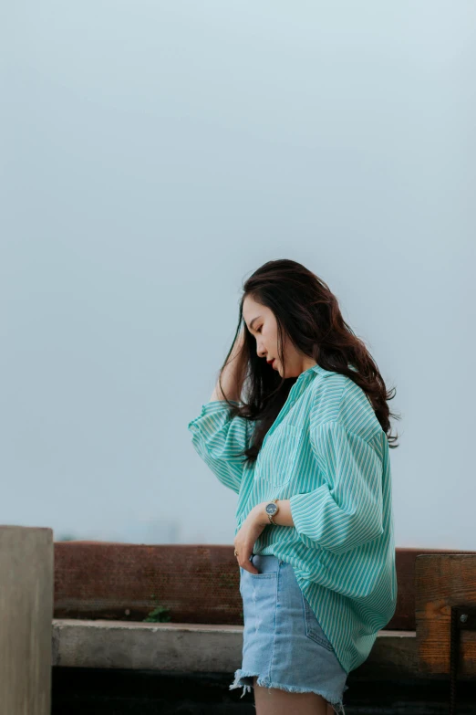 a woman sitting on top of a bench