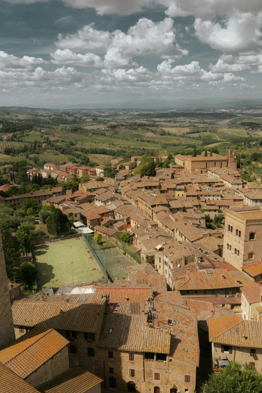 looking down at the city and fields from an old town