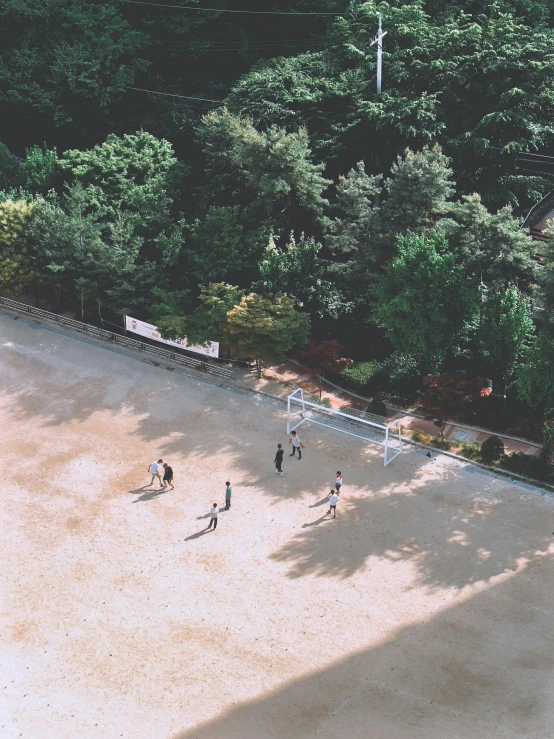 s playing with a soccer ball on an empty court