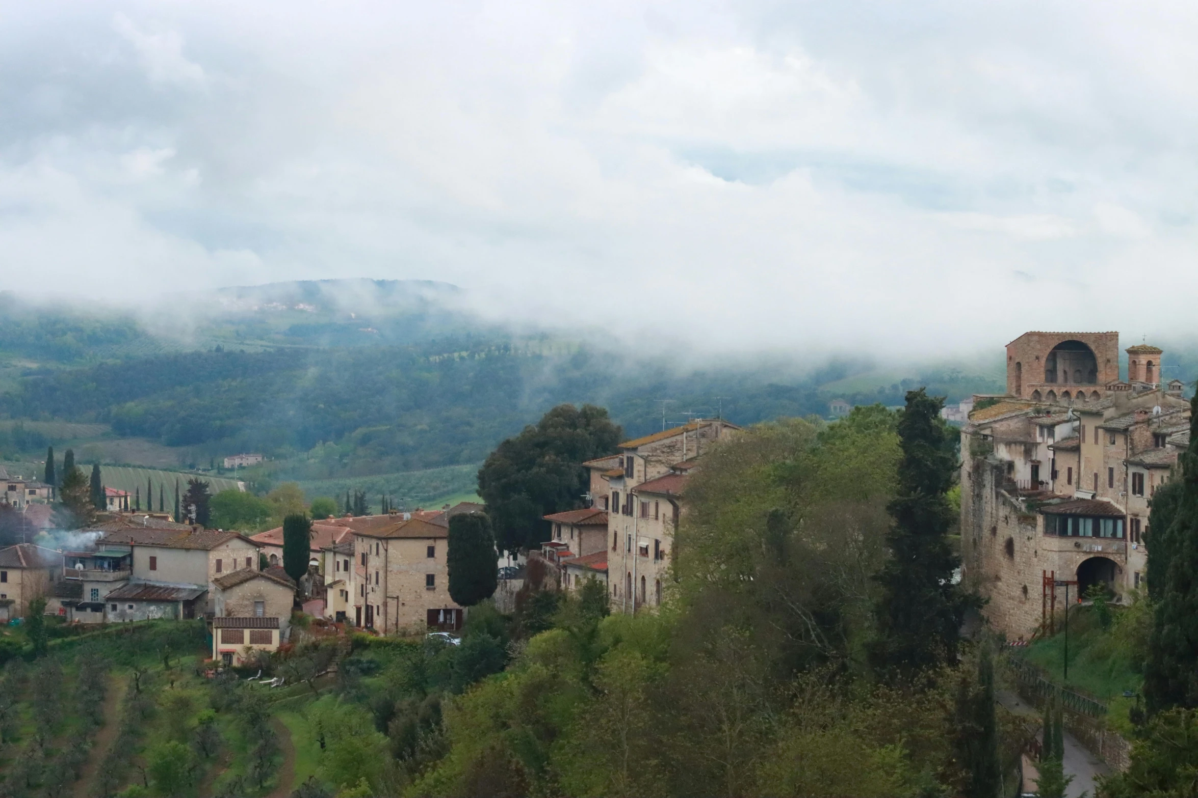 a village with mountains in the background