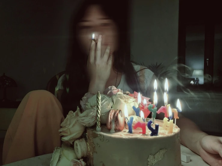 the girl has decorated the birthday cake with candles