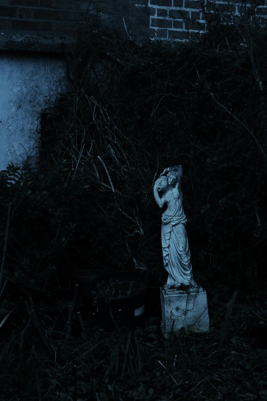 a cemetery is pictured in the dark at night