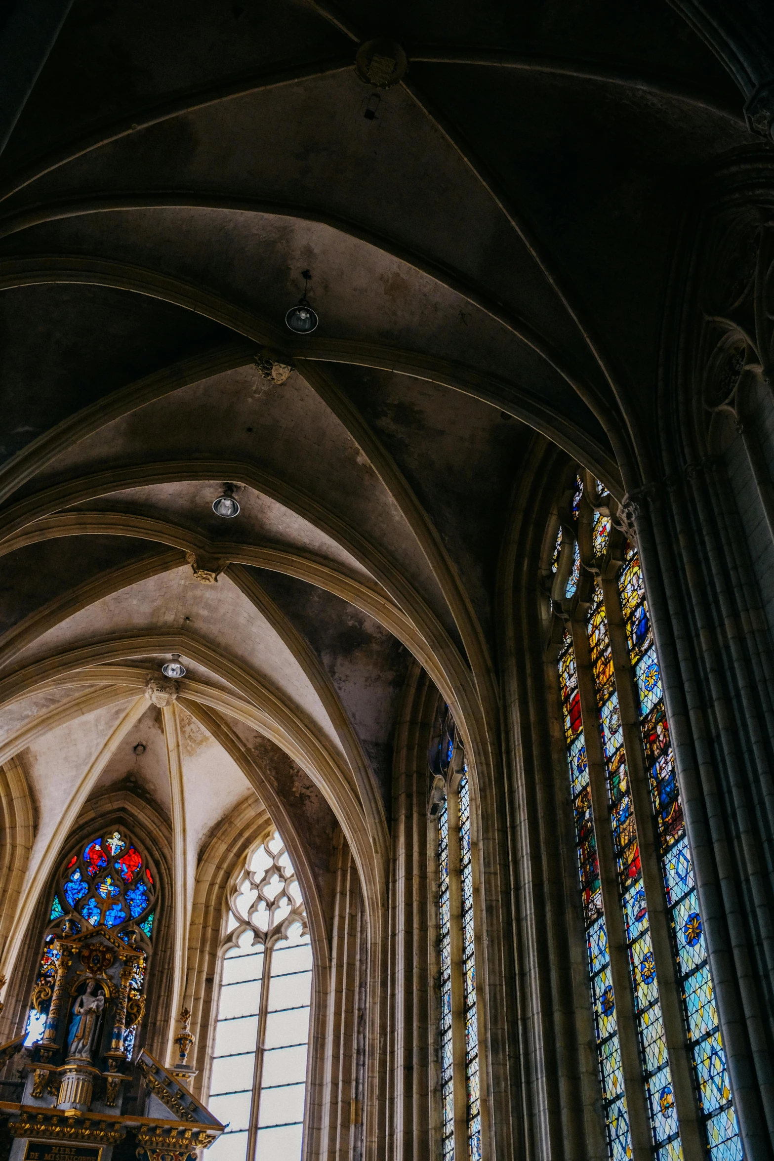 beautiful interior of an old cathedral looking into the stained glass windows