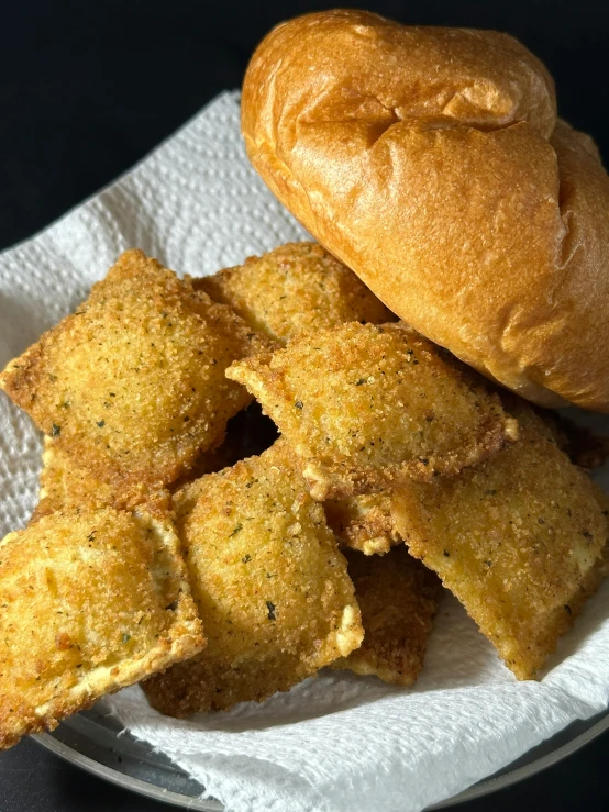 some food on a plate, including ers and rolls