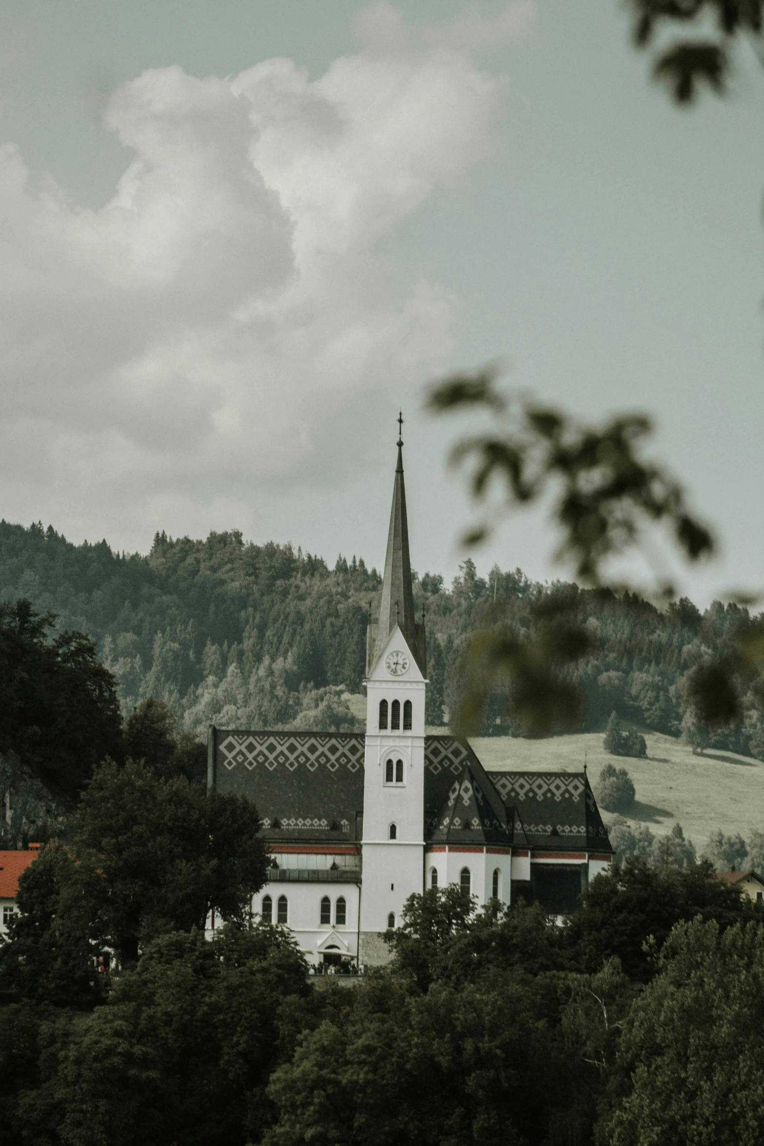 a church that is in the background with trees