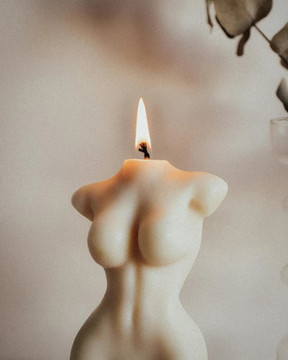 a lit candle with a small amount of wax in it