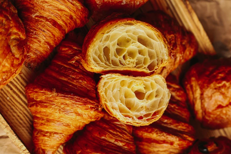 a close up of an assortment of pastries on a wooden platter