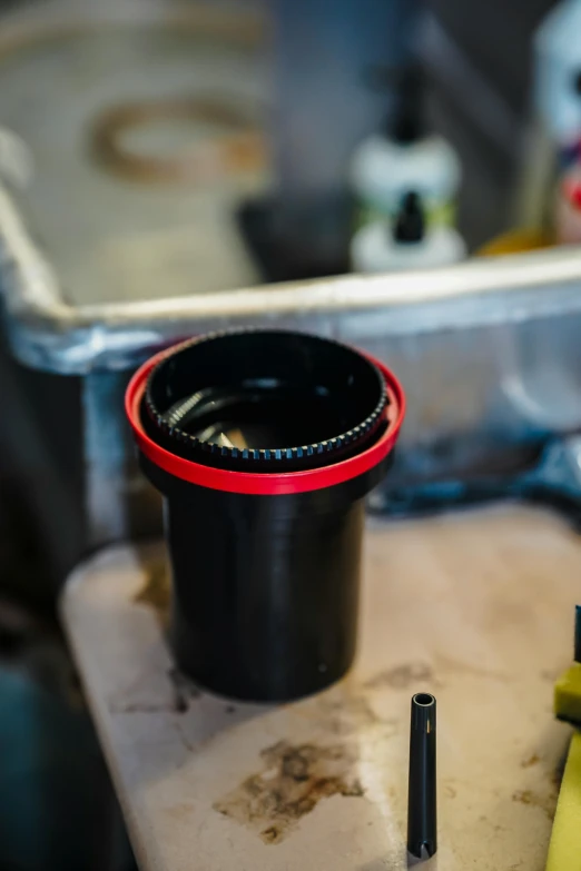 the bottom part of a camera lens and other items on top of it