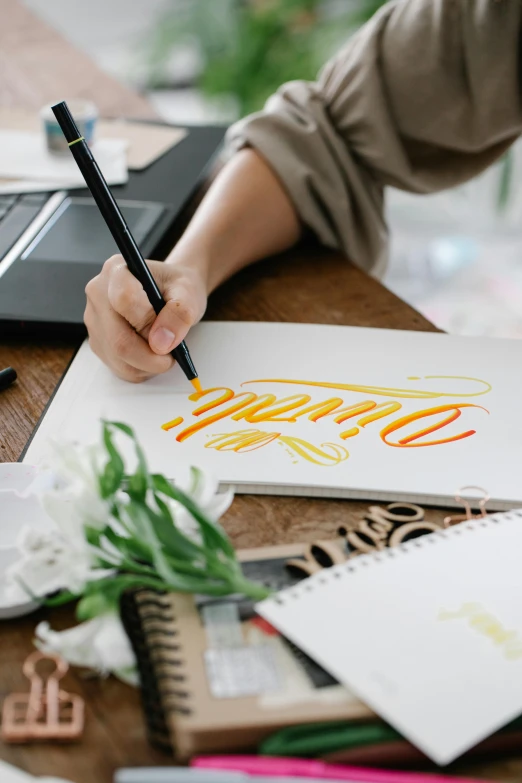 a person working on an artwork project with a marker