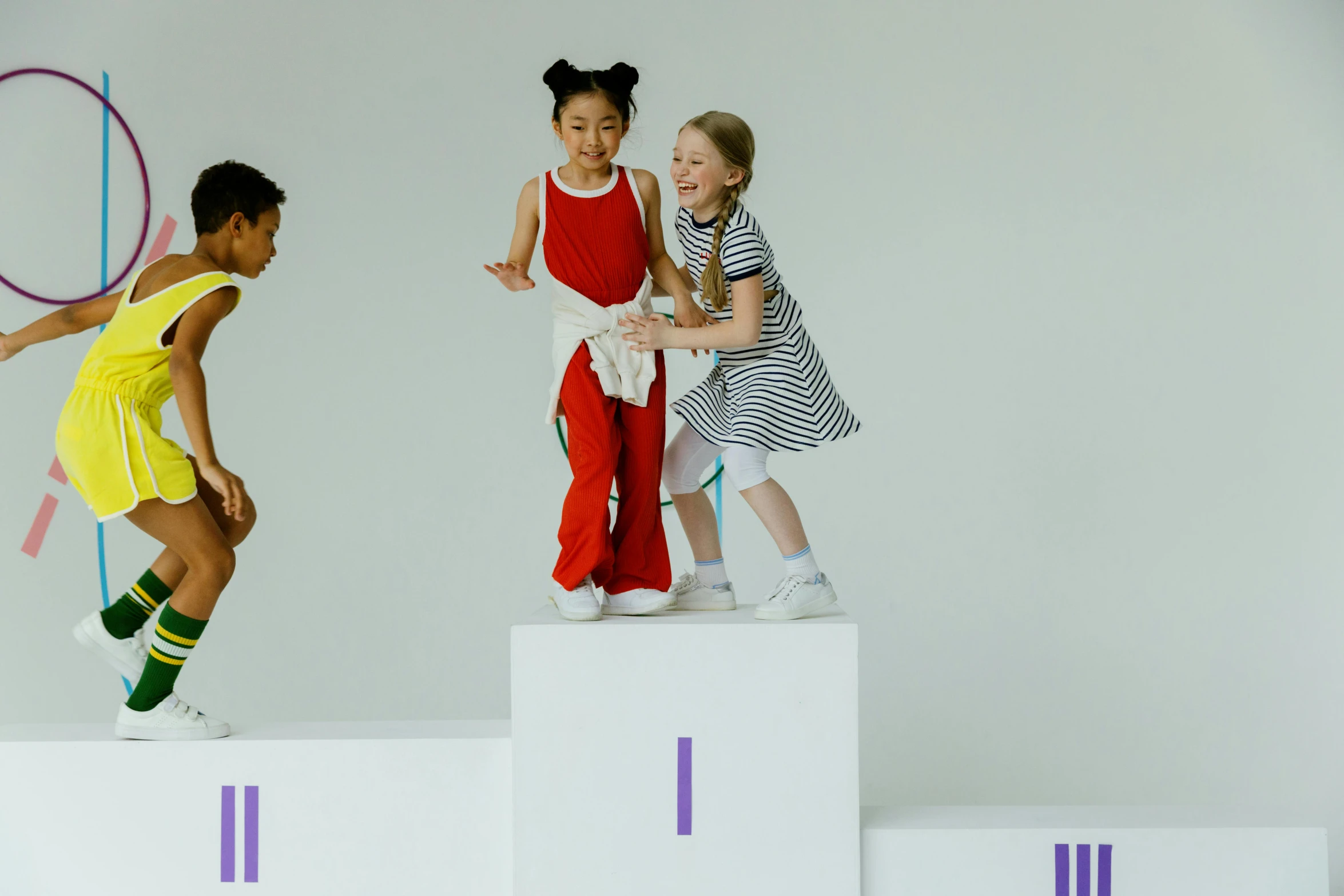 a group of s stand on a podium with hoop