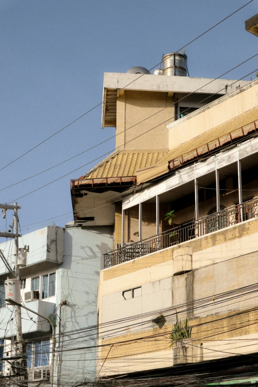 building with balconies on upper and lower story