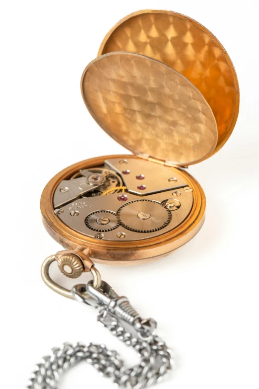 an antique pocket watch being repaired from the inside