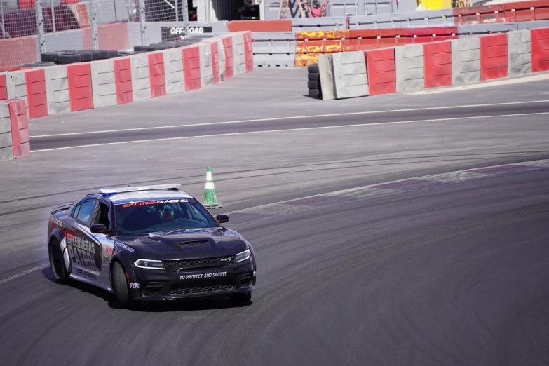 a black chevrolet camaro at the wheel