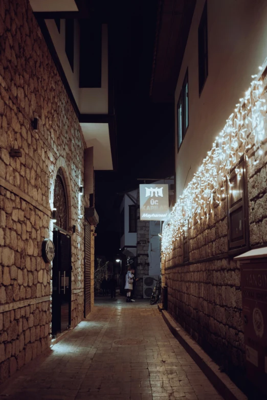 an old street with light stone walls