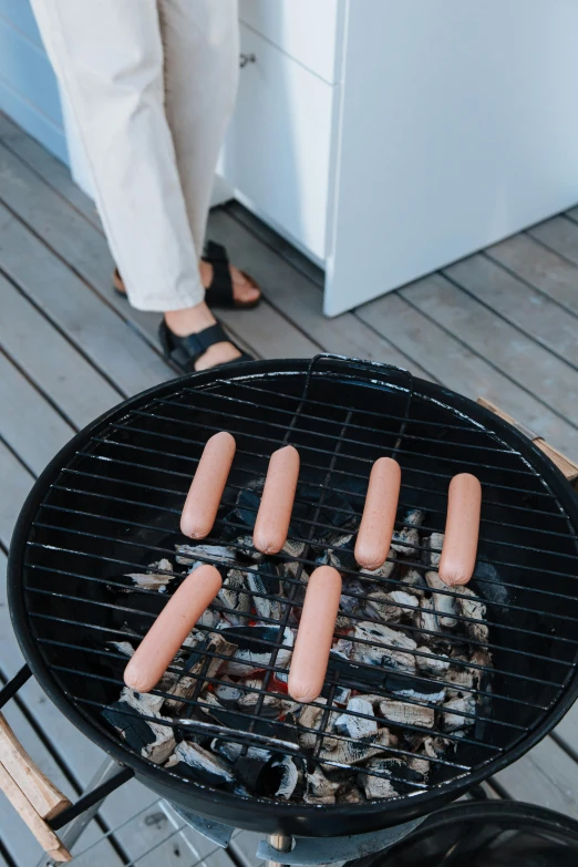 a grill on the floor with  dogs in it