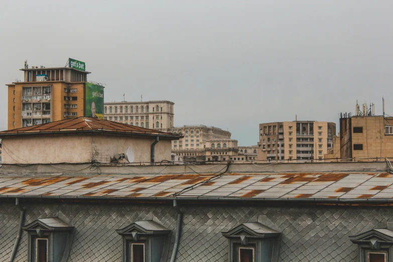 an industrial view from across the rooftops of buildings