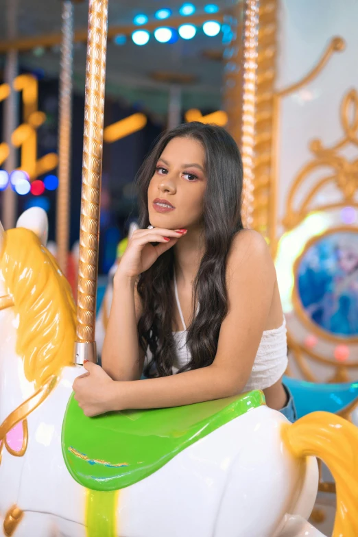 a woman on a merry go round at a carnival