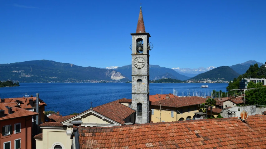 a clock tower in the middle of a small town