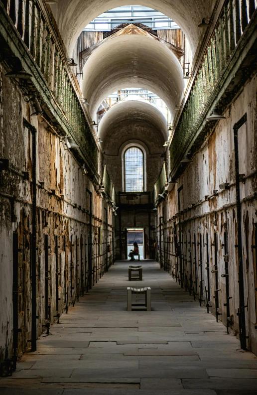 a view of the long and winding hallway inside a prison