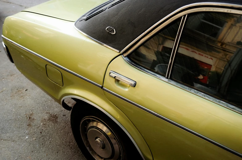 a old car with the door open and windows closed