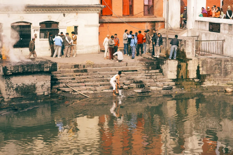 people watch and take a bath in the water