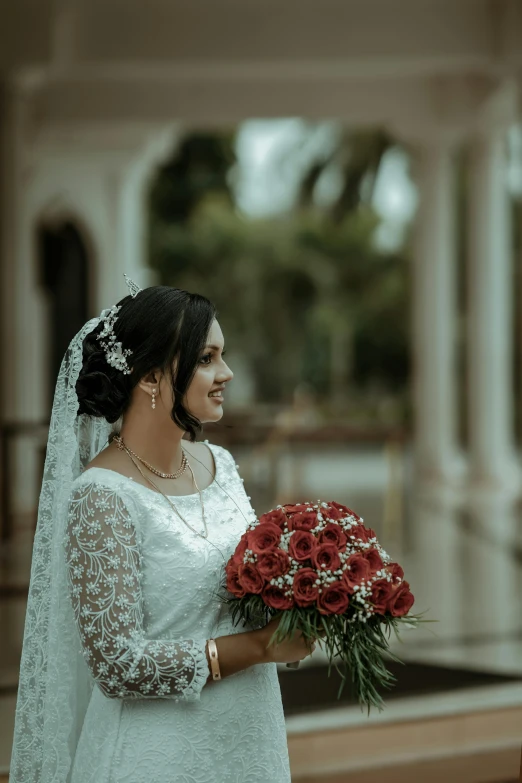 the bride in the bridal gown poses for a pograph