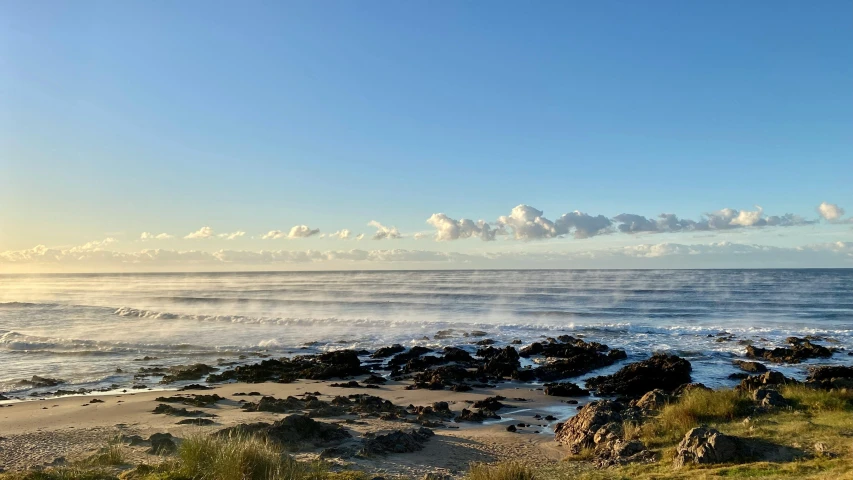 a cloudy sky is shown over the ocean