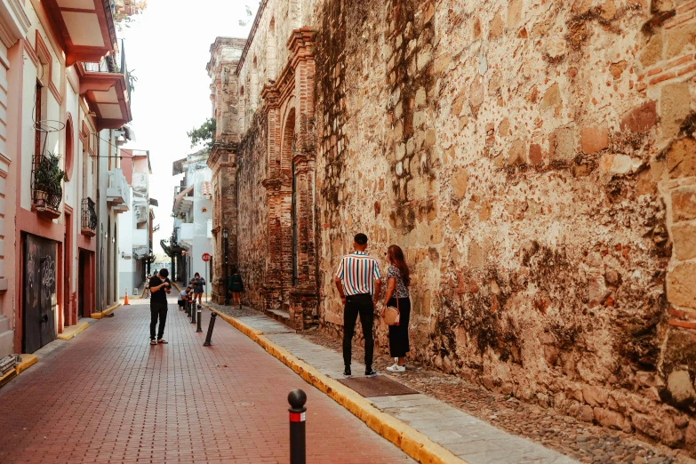 a street lined with people walking down it