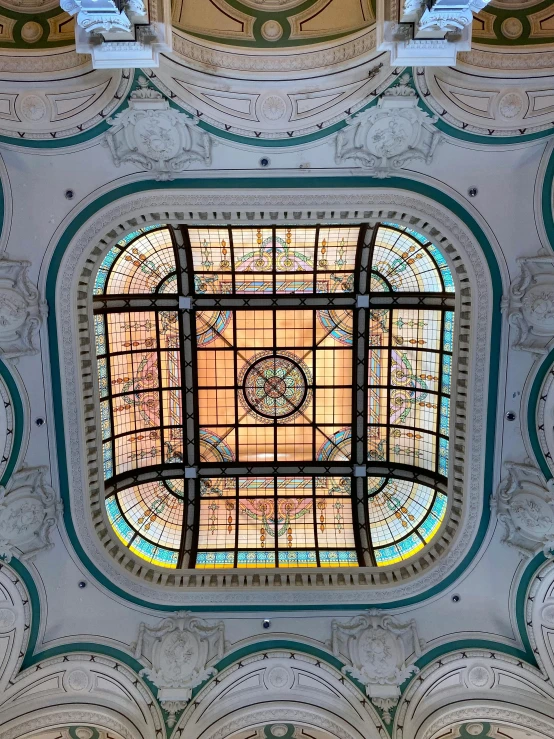 a very pretty looking glass ceiling in a building