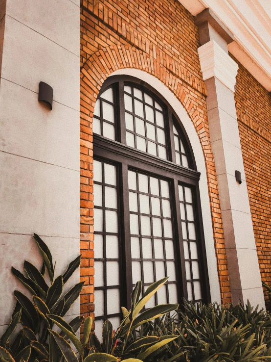 an old building has an interesting window on the side