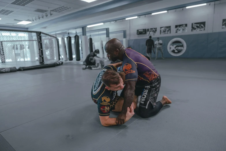 a couple of people kneeling down on a floor