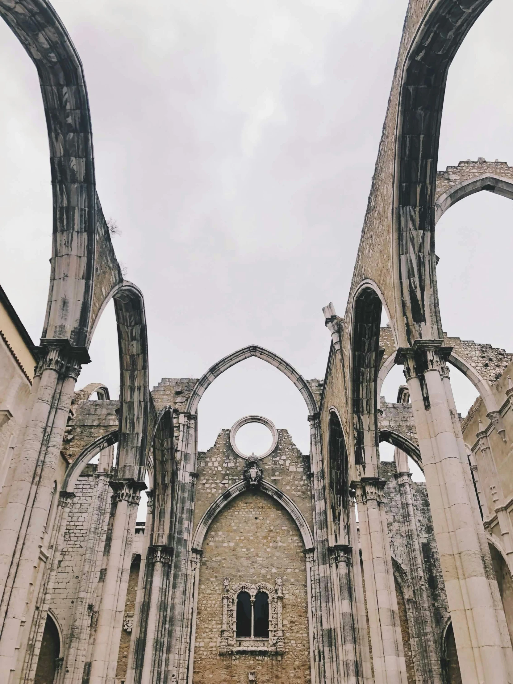 the inside of a building with several archways and columns