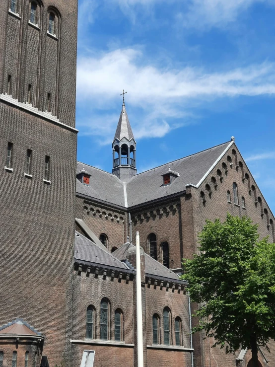 an old brown building with tall brick pillars