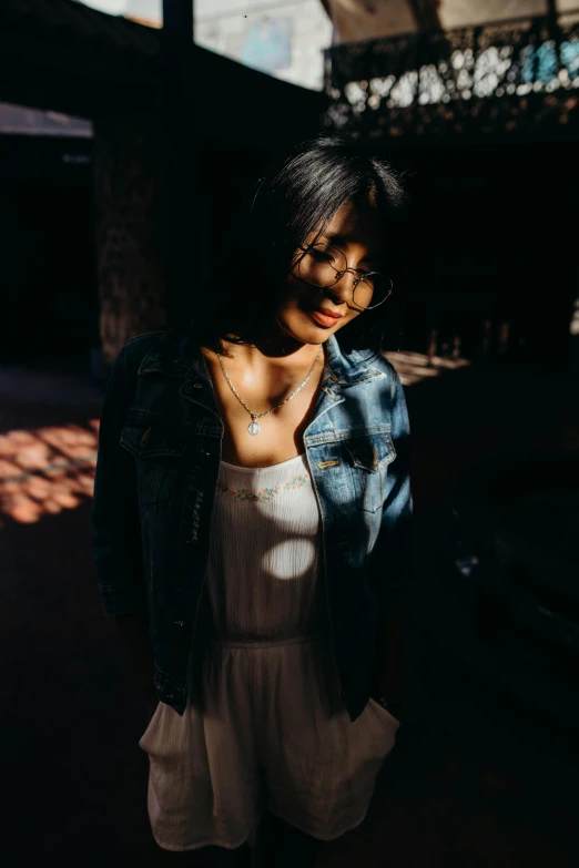 a woman in dress clothes standing in front of the camera