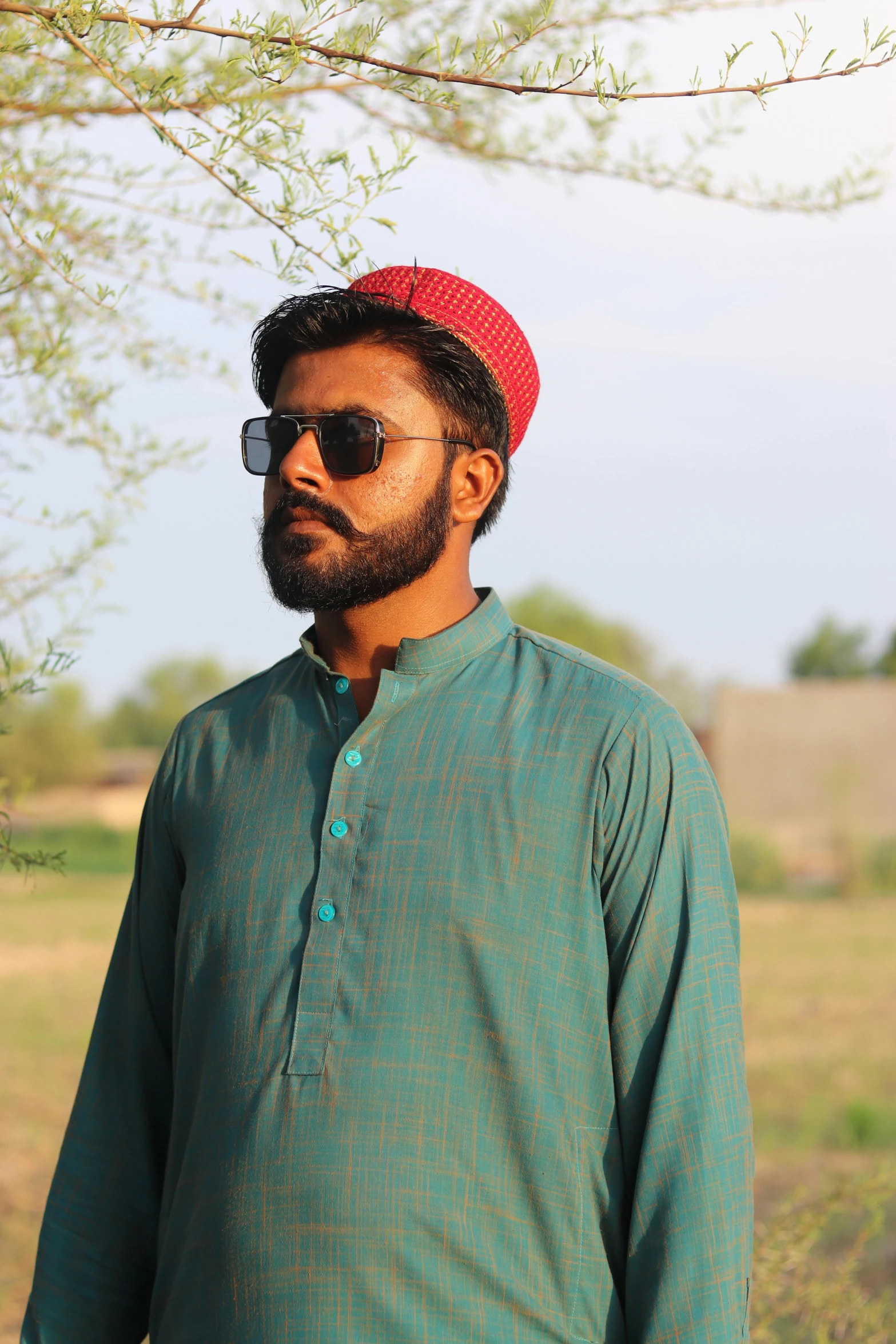 an image of a man with a beard wearing a hat