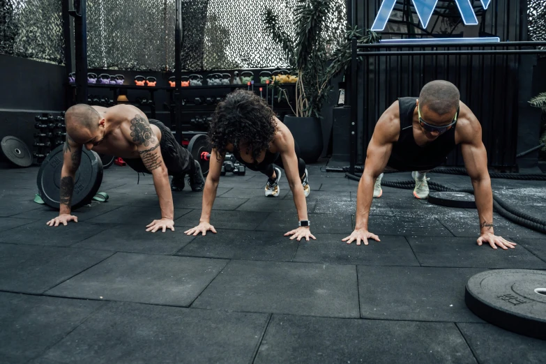 a group of people doing h up exercises